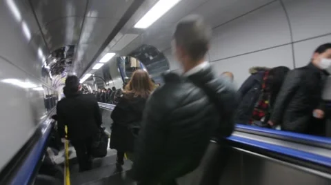 COMMUTERS GOING UP &amp; DOWN ESCALATOR AT TRAIN STATION DURING RUSH HOURS IN TOKYO Stock-Footage 59921874