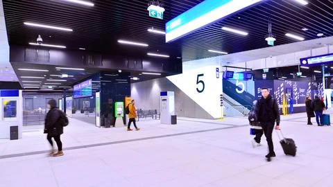 Commuters going through the underground passage hall Stock Photos