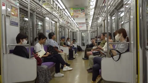 Commuters Inside of Japanese Subway Train in Kyoto Stock Footage 267423748