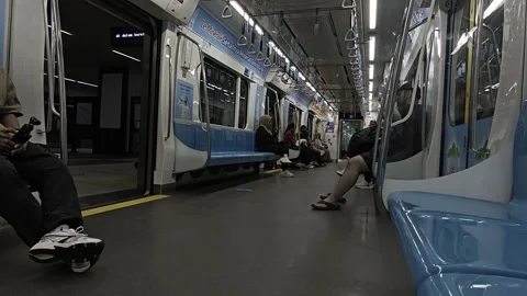 Commuters Inside a Modern Jakarta LRT Train Carriage Stock Footage 329418321