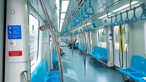 Commuters inside train wagon. Interior view of subway of moving Marmaray train Stock Footage 121404929