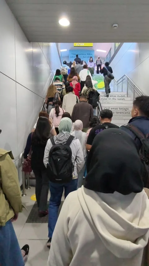 Commuters Leaving Jakarta MRT Station Using Escalator and Stairs Stock Footage 338316702