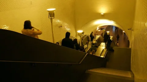 Commuters at long corrridor at Baixa Chiado Underground Train Station, Lisbon Stock Footage 102218117