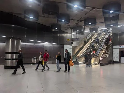 Commuters in the modern architectural interior of Tottenham Court Road Stock Photos