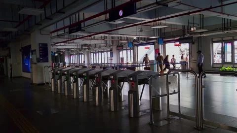 Commuters move through modern AFC gates at a Kochi Water Metro station in Kerala Vídeos de archivo 336439919