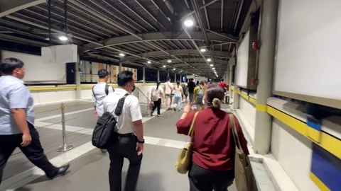 Commuters at Pasay MRT Station 4K 60fps Stock Footage 338400932