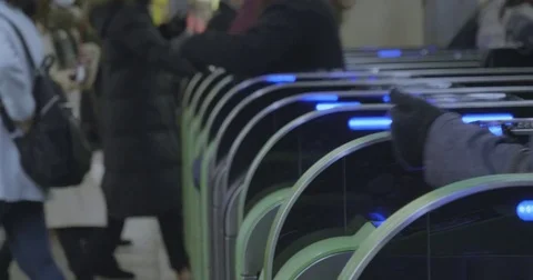 Commuters pass by automatic gate in Japanese station -tight shot- Stock Footage 84642017