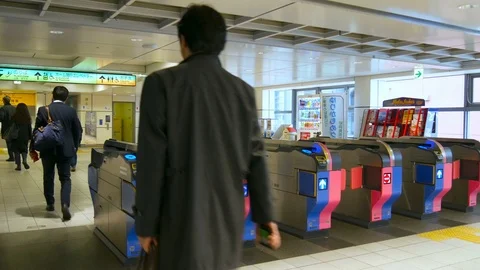 Commuters passing through ticket gate, Tokyo, Japan Video stock 107187971