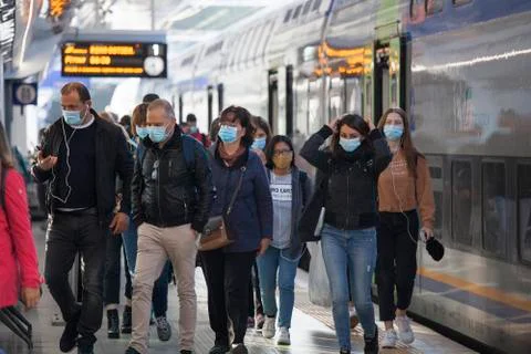 Commuters with protective face masks Stock Photos