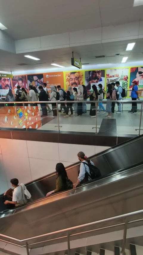 Commuters Queuing at MRT Fare Gates While Passengers Access the Platform in Jaka Stock Footage 338316746