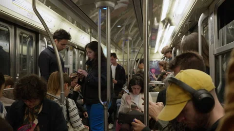 Commuters riding inside a moving underground metro train wagon in Paris Stock Footage 336723049