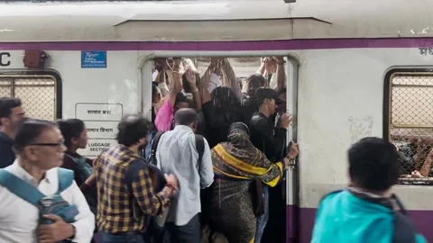 Commuters rush to board local train at Borivali station. 4K (Over crowded) Stock Footage 247119546