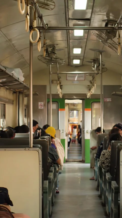 Commuters Sitting Inside a Vintage Train Carriage in Bangkok Thailand Video stock 330145852