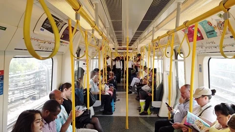 Commuters sitting in the London Underground train. Video stock 115494013