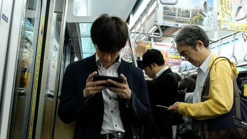 Commuters With Smartphone In Subway Train Video stock 109604423