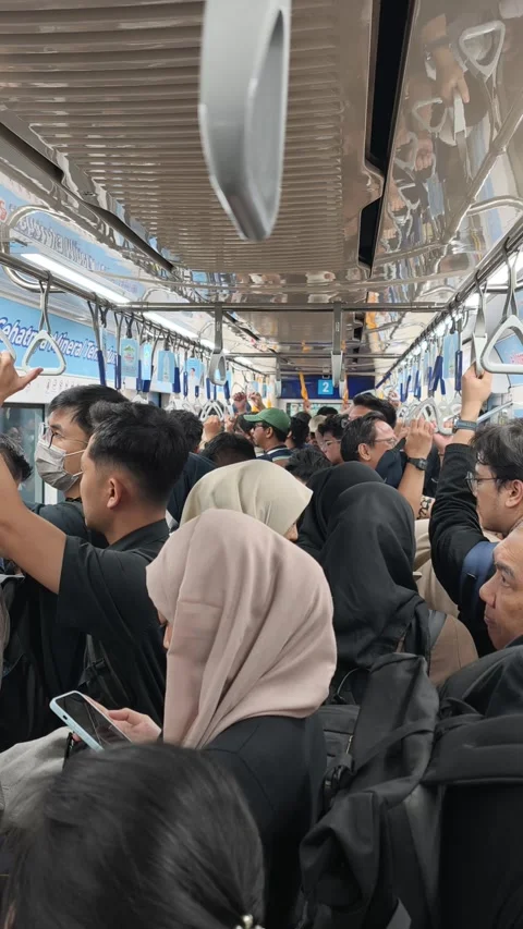 Commuters Standing Inside Jakarta MRT Train During Evening Rush Hour Stock Footage 338316578