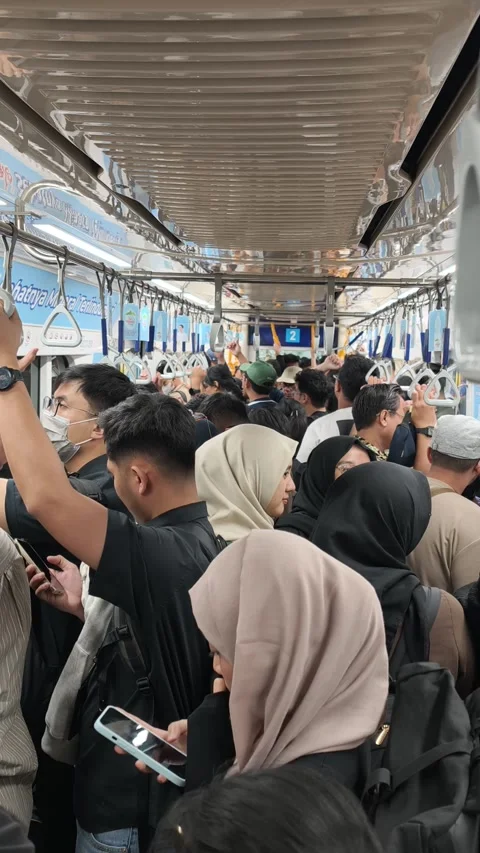 Commuters Standing Inside Jakarta MRT Train During Evening Rush Hour Stock Footage 338316655
