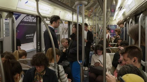 Commuters standing inside open subway train wagon during Paris transit Stock Footage 336722915