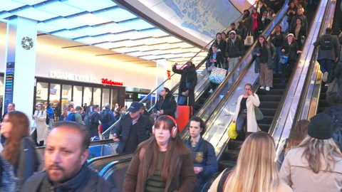 Commuters take elevator at the Penn Station during evening commute rush hours. Stock Footage 295932413