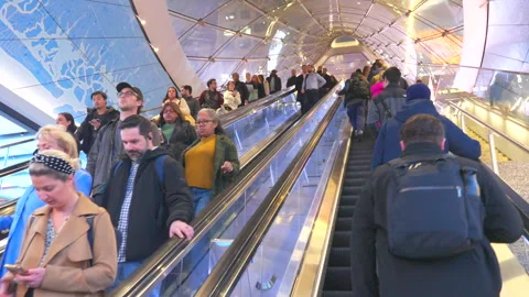 Commuters take elevator at the Penn Station during evening commute rush hours. Stock Footage 295932917