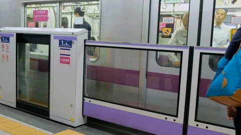 Commuters At Tokyo Subway Platform Video stock 111447131