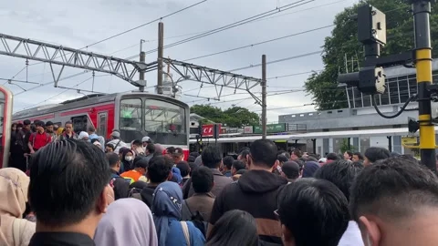 Commuters on a train platform during daily public transportation activity. Stock Footage 327263501