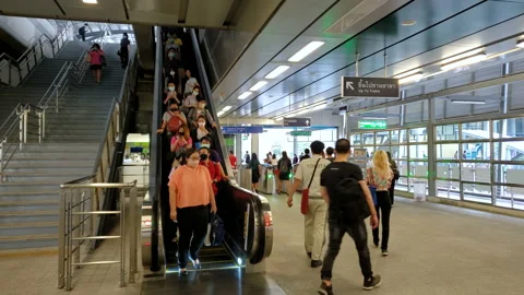 Commuters at Train station all wearing face masks against covid-19 in Thailand Stock Footage 141727138