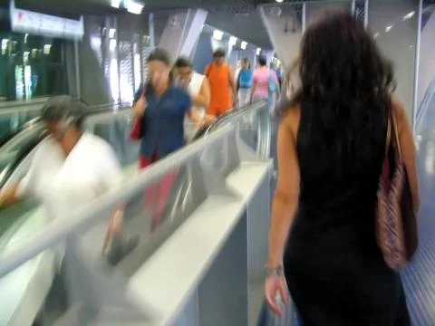 Commuters in a train station. Motion blur effect. Stock Photos