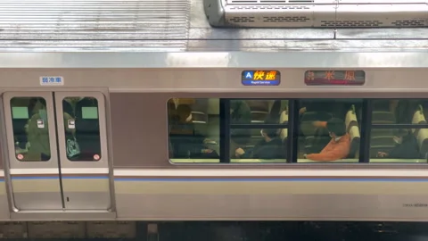 Commuters on train waiting to depart. Stock Footage 250499130