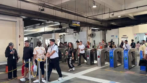 Commuters Using Card Scanners at MRT Station, Pasay 4K 60fps Video stock 338399858