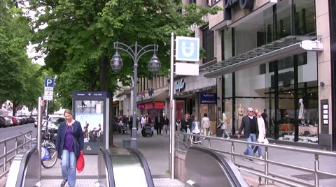 Commuters using escalator to underground metro station in Dusseldorf Stock Footage 51867136