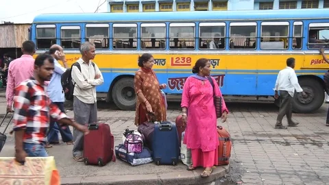 Commuters wait at Howrah Bus Stand Video stock 77436705