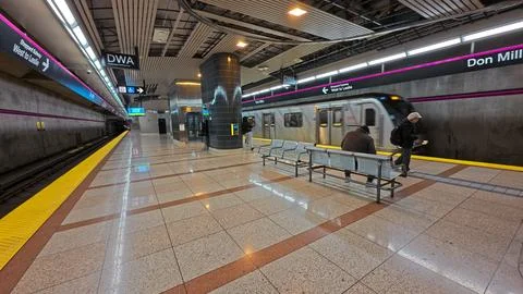 Commuters wait for subway train at Don Mills station Stock Photos