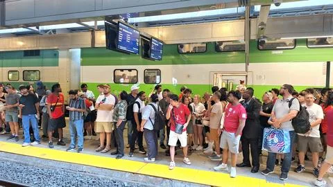 Commuters wait on a train platform in Toronto. Stock Photos