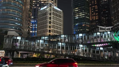 Commuters Walk Across an Elevated Pedestrian Bridge Stock Footage 338444623