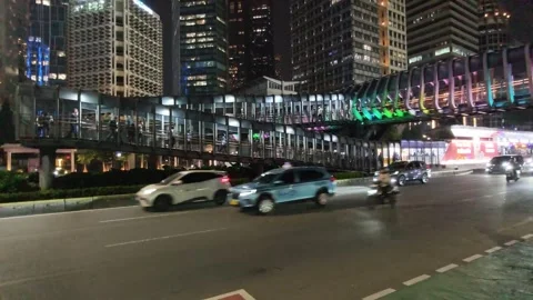 Commuters Walk Across an Elevated Pedestrian Bridge Stock Footage 338444668