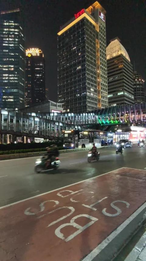 Commuters Walk Across an Elevated Pedestrian Bridge Stock Footage 338446363