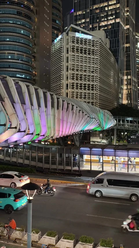 Commuters Walk Across an Elevated Pedestrian Bridge Stock Footage 338447554