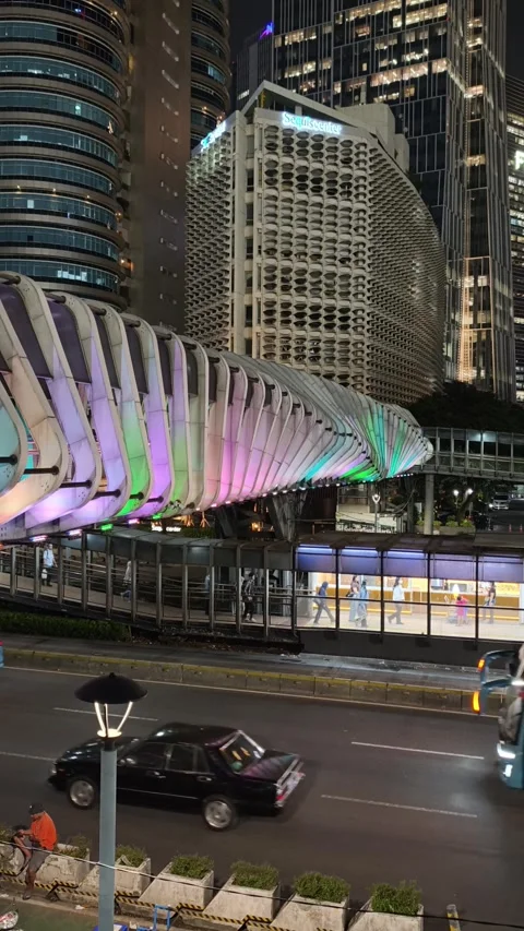 Commuters Walk Across an Elevated Pedestrian Bridge Stock Footage 338448109
