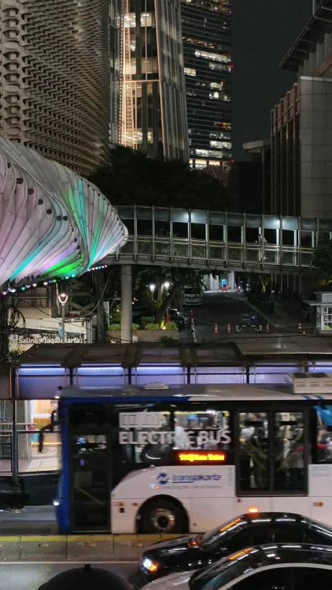 Commuters Walk Across an Elevated Pedestrian Bridge Stock Footage 338664495