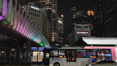 Commuters Walk Across an Elevated Pedestrian Bridge to Bus Shelter Stock Footage 339145976