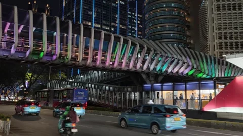 Commuters Walk Across an Elevated Pedestrian Bridge to Bus Shelter Stock Footage 339148179