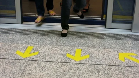 Commuters walk out of train Stock Footage 103350171