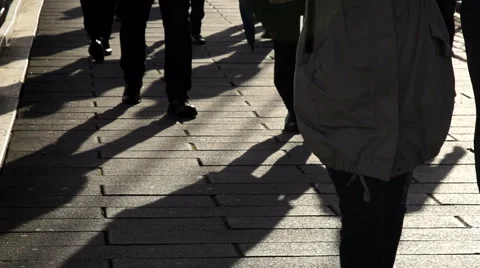 Commuters walking on a bridge over River Thames - slow motion Stock Footage 40263483