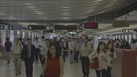 Commuters walking in the crowded Central railway station in China Stock Footage 73698860