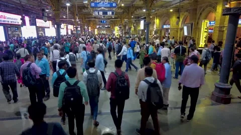Commuters walking at Dadar railway skywalk, Mumbai, India Stock Footage 252109791