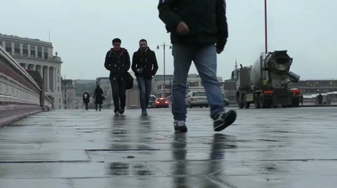 Commuters walking home on a cold wet afternoon Stock Footage 45551939