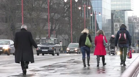 Commuters walking home on a cold wet afternoon in London Stock Footage 45552018
