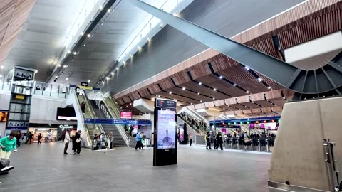Commuters walking inside modern London Bridge Station Stock Footage 308938338
