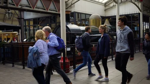 Commuters walking past "The Queen" train, Windsor Station, UK - Sept 9, 2017. Stock Footage 86605066